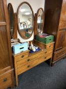 A 19th century inlaid mahogany sunk-centre dressing chest with triple mirror