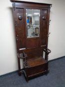 An Edwardian oak hall stand