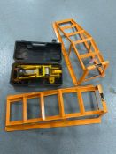 A cased two tonne hydraulic jack together with a set of car ramps.