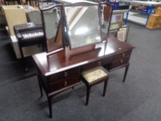 A Stag Minstrel dressing table with triple mirror and stool