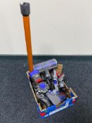 A Dyson V8 hand held vacuum with accessories.