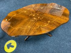 An Italianate shaped pedestal coffee table