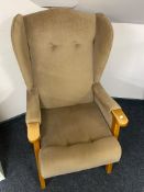 A 20th century wingback armchair