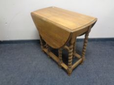An oak barley twist gate leg table.