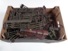 A box containing mid 20th century tin plate track and Royal Scot engine.