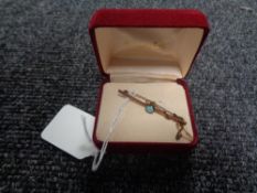 A 9ct gold bar brooch set with an opal, weight 2.2g.