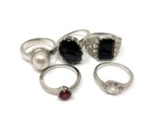 Five silver gem set dress rings.
