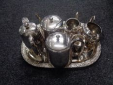 A 20th century oval plated tray containing six pieces of plated tea ware.