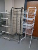 A metal tray trolley together with two shop display stands.