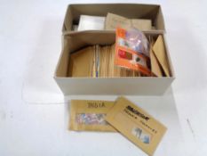 Two boxes of loose stamps, World and GB.