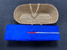 A Graco Cumfi folding travel cot together with a Moses basket.