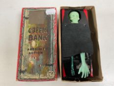 A mid 20th century tin plate coffin bank, boxed.