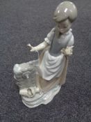 A Nao figure, girl by well.