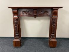 A carved eastern fire surround