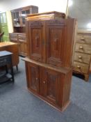 Two antique oak double door wall cabinets.