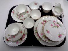 A tray containing 21 pieces of antique pink rose patterned tea china.