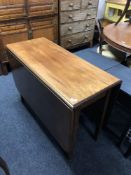 A 19th century mahogany drop leaf table.