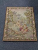 A tapestry mounted on board depicting three figures in a garden.