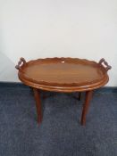 A twin-handled butler's tray on stand