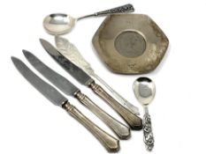 A collection of silver items including two ornate Norwegian spoons