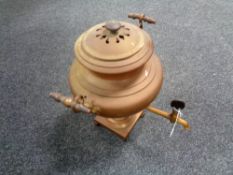 An antique brass tea urn.