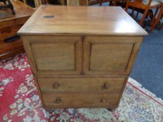 A Georgian mahogany commode chest