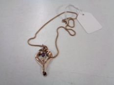 An Edwardian yellow gold pendant suspended on later yellow metal chain with bale stamped 375.