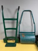 A garden roller together with a sack barrow.