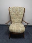 An Ercol elm and beech armchair