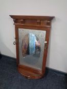 An Edwardian frosted glass framed hall mirror with shelf and coat hooks