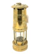 A brass miner's lamp by E Thomas & Williams Ltd