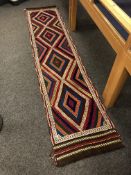 A Suzni kilim runner 313 x 68 cm.