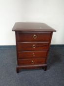 A Stag Minstrel four drawer bedside chest