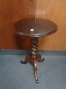 A wine table on three way barley twist pedestal