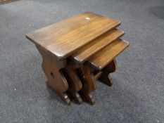 A nest of three oak tables.