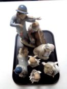 A tray of Lladro figure of a cherub together with two further Leonardo Collection figures of