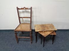 An Edwardian bergere seated bedroom chair together with a nest of three mid century tables
