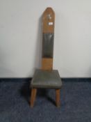 An oak leather seated spinning chair