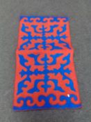 A felt mosaic applique rug.