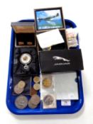 A tray of £2 coins, assorted commemorative crowns,