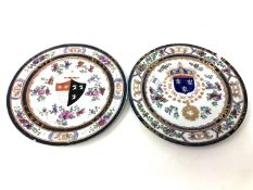 A pair of 19th century armorial cabinet plates, width 24 cm.