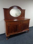 A mahogany bow fronted Queen Anne style mirror backed sideboard