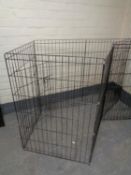 A folding metal dog pen