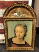 A religious print in an ornate frame, 23 x 36 cm.