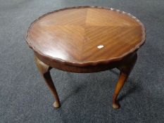 A 20th century pie crust edge coffee table.