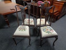 A set of four Edwardian mahogany Queen Anne style dining chairs with tapestry upholstered seats