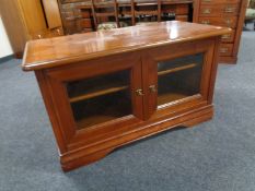 An Ernest Menard double door entertainment stand