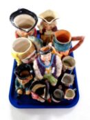 A tray containing a collection of assorted Toby jugs.