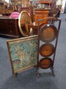 A three tier folding oak cake stand together with a folding tapestry fire screen table