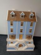 A Georgian style double fronted doll's house together with two boxes containing a large quantity of